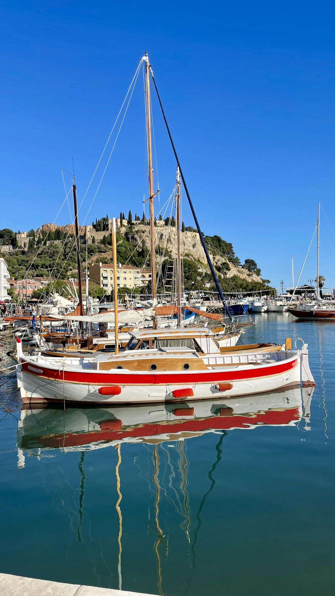 A picturesque view of sailboats moored at the harbor in Cassis, Provence-Alpes-Côte d'Azur, France.