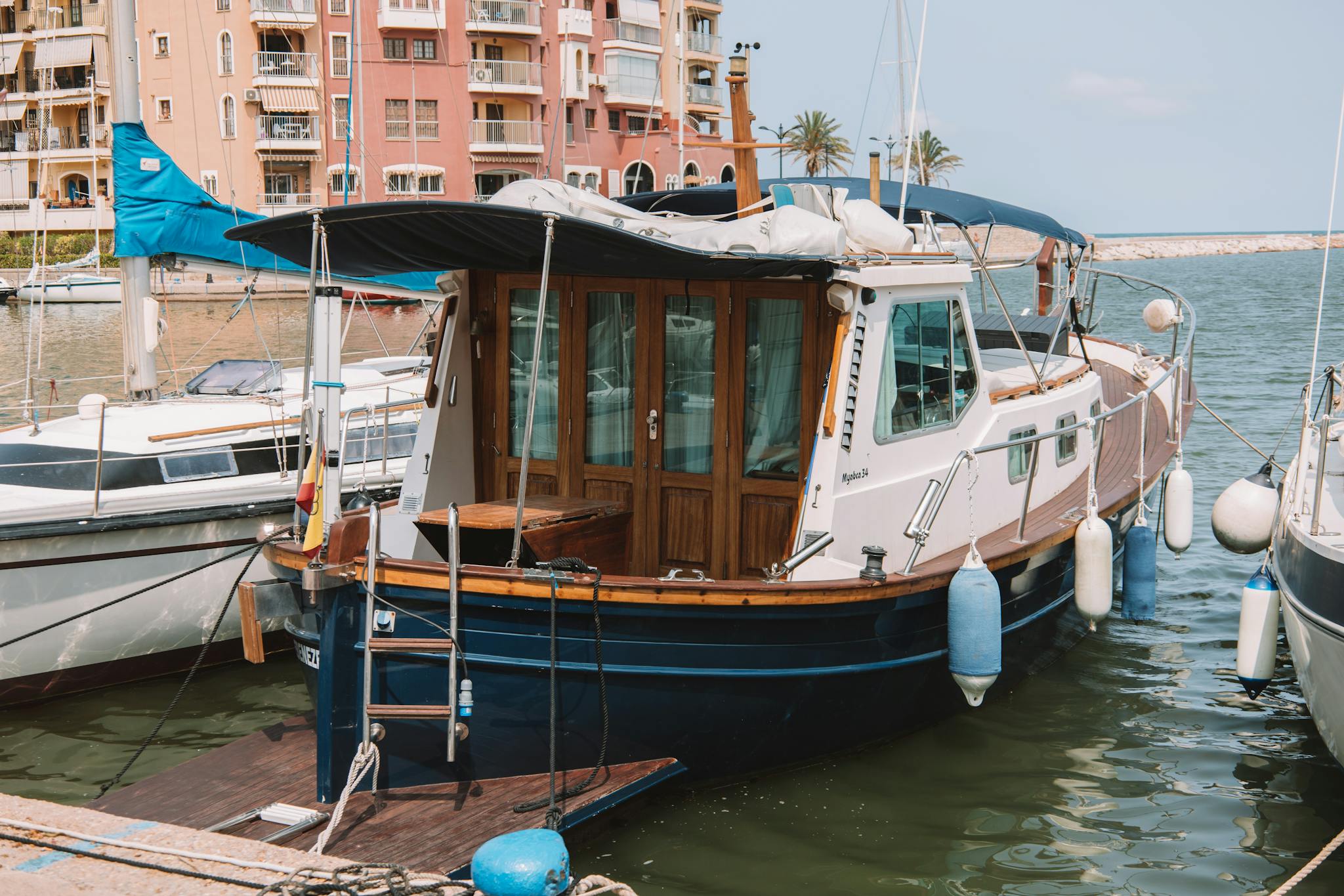 Charming boats docked at the scenic marina in Valencia, Spain's vibrant city.